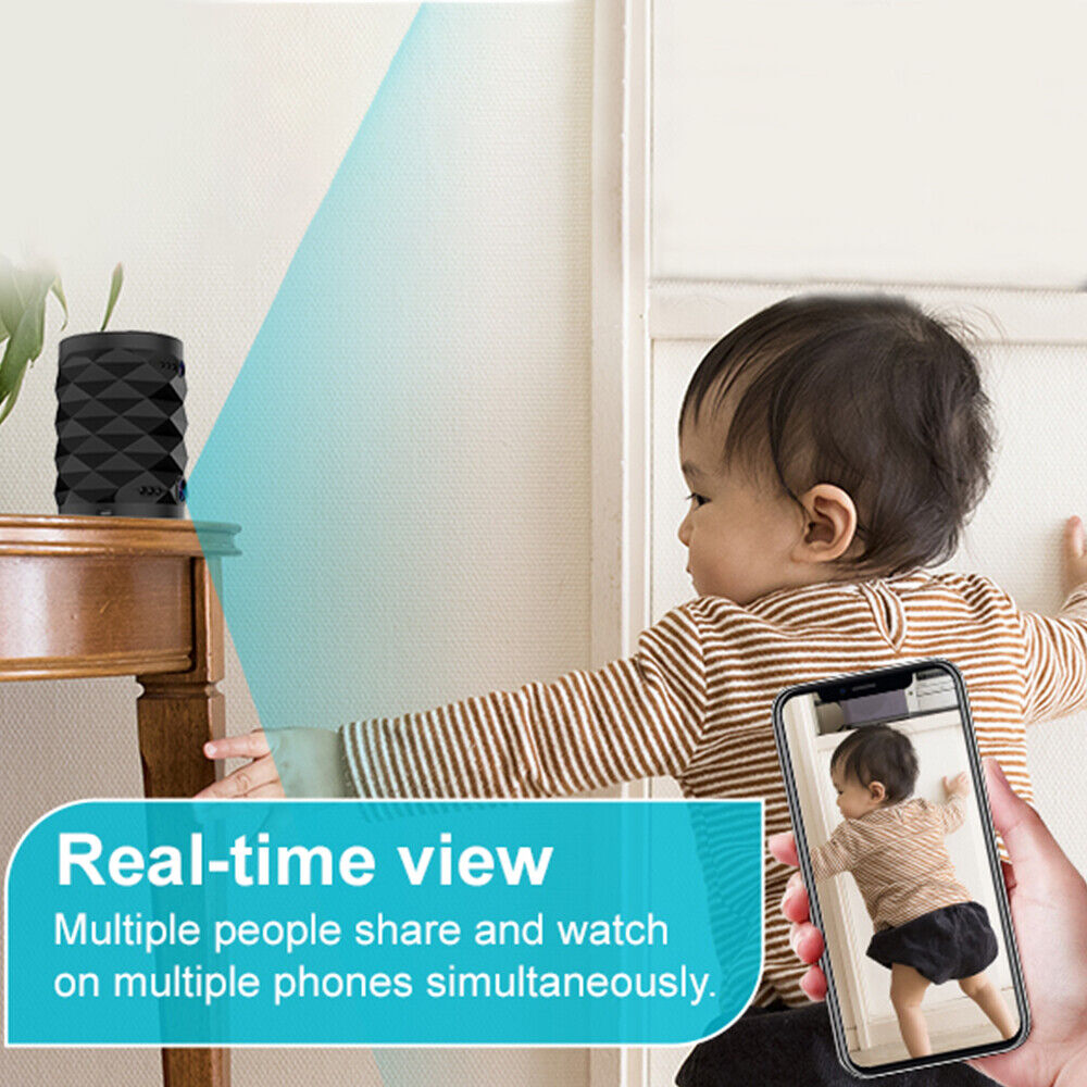 A baby stands by a table with the Bluetooth Speaker SpyCam nearby, as a hand holds a phone showing its live video feed. Text reads, “Real-time view. 24/7 security—multiple people can watch on multiple phones simultaneously.”.