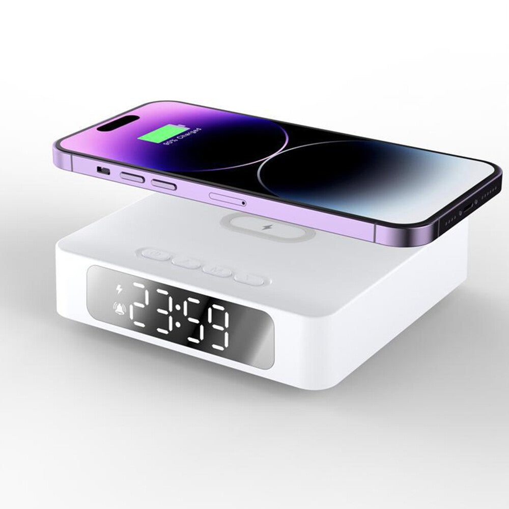 A smartphone charges wirelessly atop the Wireless Charger Clock SpyCam, a white digital clock with an LED display showing 23:59, featuring a built-in wireless charger and motion detection for added convenience.