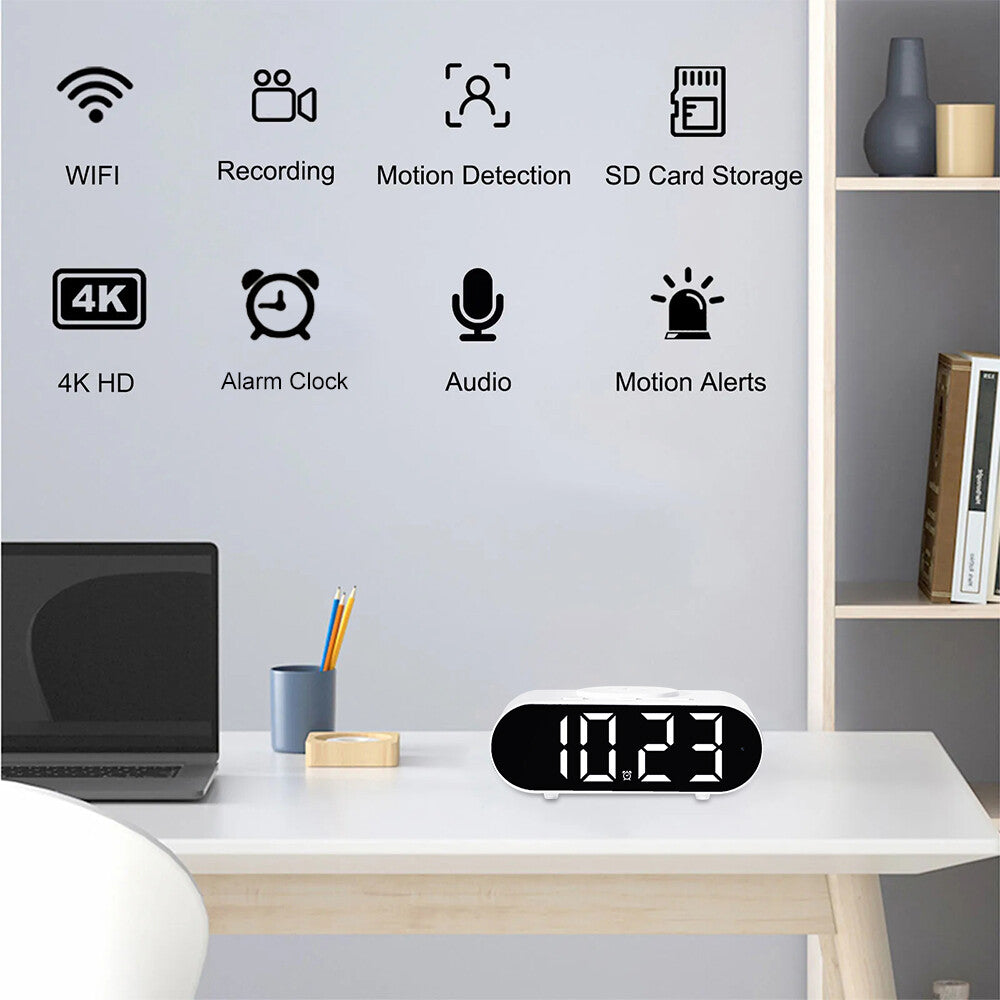 The Digital Clock Charger SpyCam sits on the desk; wall icons and text highlight features such as WiFi Surveillance, hidden camera, motion detection, SD card storage, 4K HD video, alarm, audio, wireless charging, and motion alerts.