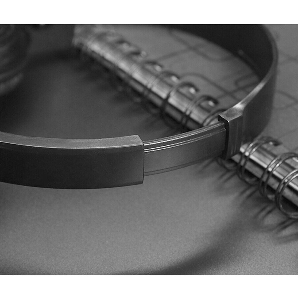 Close-up of a Wired Bass Stereo Headphone with high-definition drivers and immersive bass, resting on a spiral-bound notebook.