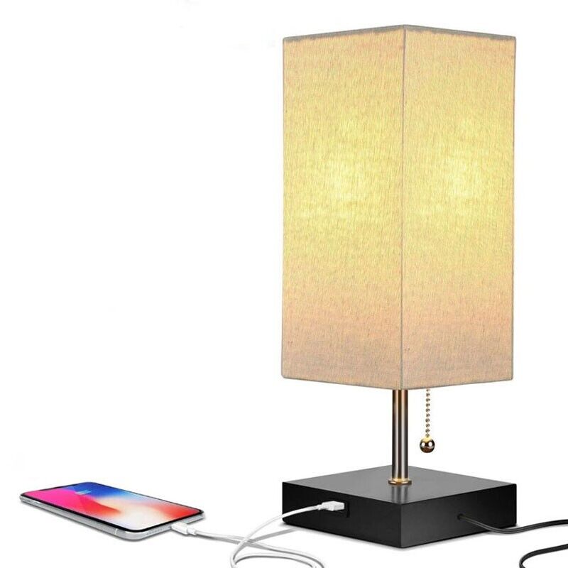 The Desk Lamp Charging SpyCam, inspired by James Bond, brightens rooms with a rectangular shade. It includes a pull chain and USB port at the base to easily charge your smartphone, offering an ideal mix of style and functionality.