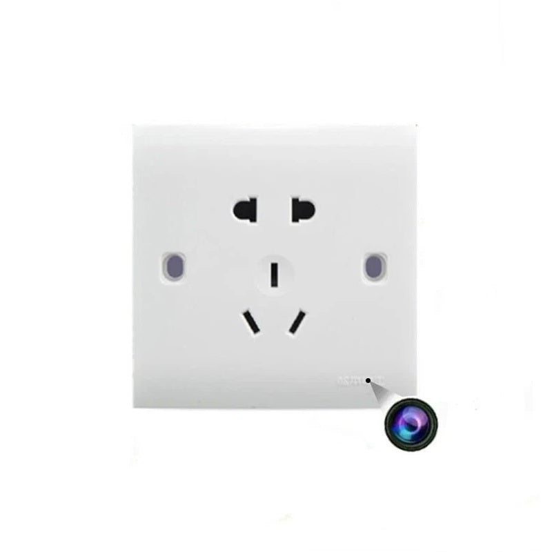 The Smart Electrical Outlet SpyCam is a white outlet with three plug interfaces and a hidden lower right camera lens, offering discreet real-time recording as a spy cam outlet.
