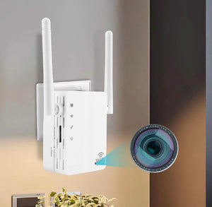 A white SpyCam WiFi Repeater with two antennas is plugged into a wall outlet; a graphic overlay displays a camera lens and WiFi symbol, hinting at its hidden camera functionality.