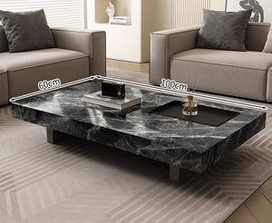 The Modern Luxe Coffee Table, a rectangular black marble piece (60 cm x 100 cm), sits between two beige sofas and enhances the sleek, modern vibe of this living room.