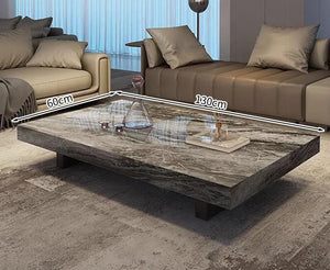 The Modern Luxe Coffee Table, a rectangular minimalist design in marble (130cm x 60cm), is ideal for placing on a rug between two sofas—perfect for stylish, modern interiors.