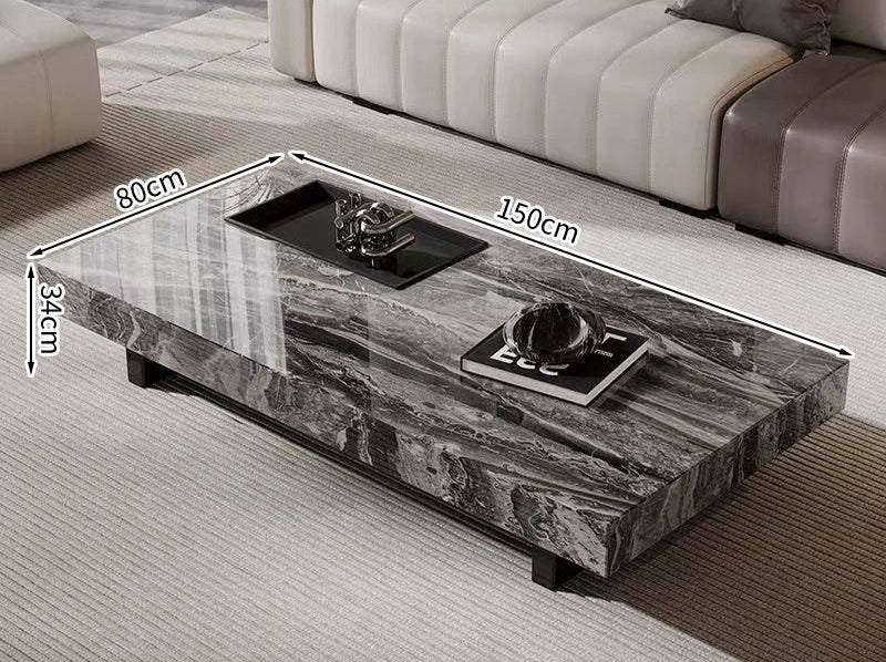 The Modern Luxe Coffee Table features a glossy gray and black marble surface in a 150x80x34cm rectangular design, set on a light carpet between sofas—ideal for modern interiors.
