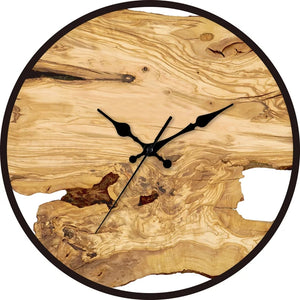 The Wood Circle Wall Clock boasts a rustic design, crafted with natural wood grain and sleek black hands, elegantly presented without numbers.