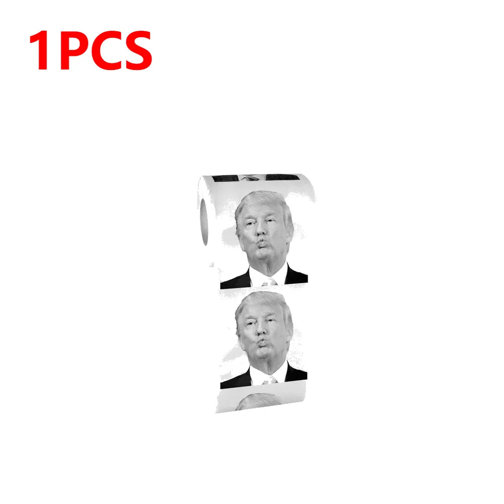 A roll of Trump Toilet Paper featuring repeated black and white images of Donald Trump's face, with "1PCS" highlighted in red text at the top left.