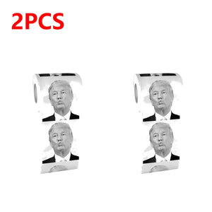 Trump Toilet Paper comes in a 2PCS pack with each roll featuring a repeated image of Trump's face, adding humor to your bathroom. The bold red "2PCS" label in the top left corner highlights its satirical appeal.