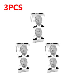 Trump Toilet Paper includes three rolls, each featuring repeated black-and-white images of Trump's face for a satirical touch, with "3PCS" in bold red text at the top left.
