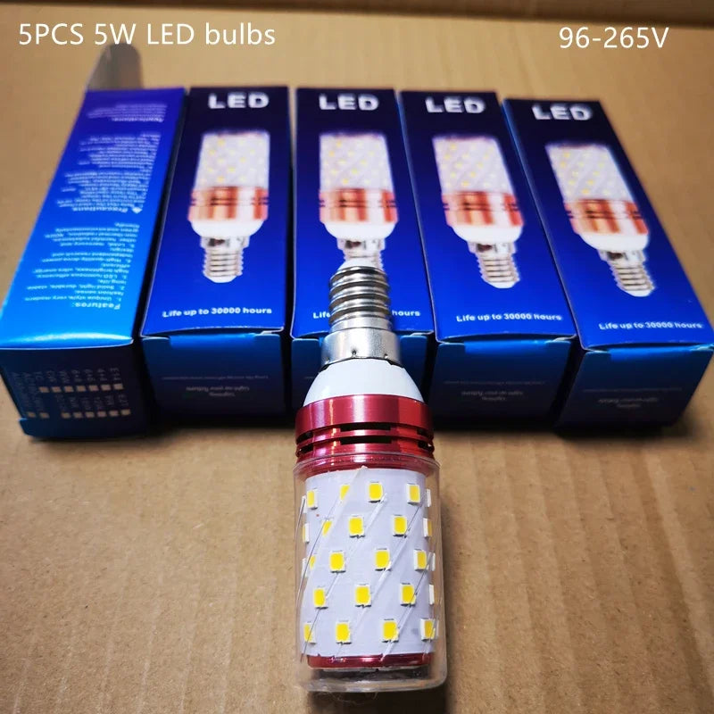 A set of five Sleek Industrial Pendant Light 5W LED bulbs is displayed on a cardboard background. One bulb, upfront, shows brass connectors; others remain in blue packaging behind. Text highlights power and voltage specifications.