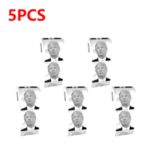 Trump Toilet Paper: Five rolls, each with a repeated black and white portrait of Trump in a suit and "5PCS" in red at the top corner—perfect for adding humor to your bathroom.