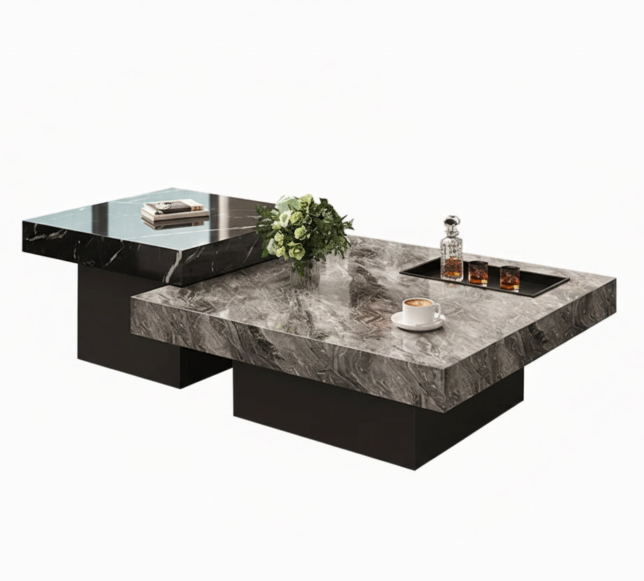 Two Modern Luxe Coffee Tables with marble tops enhance modern interiors—one holds a tray with decanter, glasses, cup, saucer, and a small bouquet; the other displays a closed book.