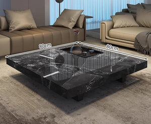 The Modern Luxe Coffee Table features a square black marble design with a reflective surface, measuring 80cm per side—ideal for placement between sofas in contemporary living rooms.