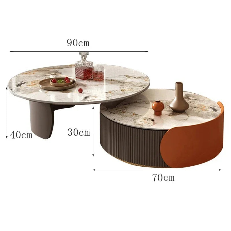 The Luxe Round Coffee Table set includes two nesting tables (90x40cm and 70x30cm) with elegant marble tops, beautifully displayed together and adorned with decorative items.