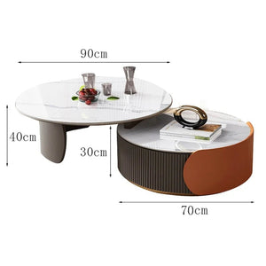 The Luxe Round Coffee Table set features two round nesting tables with sintered stone tops—one 90cm wide, 40cm high, the other 70cm by 30cm—perfect for elegantly displaying books and decorative items.