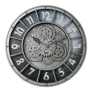 The Industrial Gearworks Wall Clock is a round steampunk style clock featuring visible metal gears in the center and distressed white numerals on a dark background. The time displayed is 1:52.