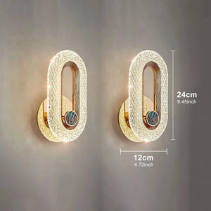 The Luxury Wall Sconce features a pair of modern and stylish oval-shaped wall sconces with textured surfaces that are illuminated. Each LED sconce measures 24 cm (9.45 inches) in height and 12 cm (4.72 inches) in width, making them perfect for indoor lighting.