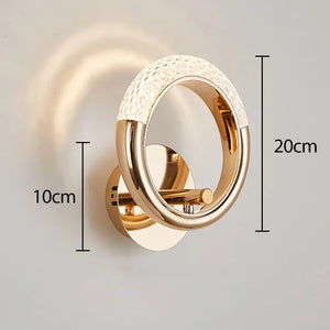 Elegant Ring Wall Sconce featuring a gold circular design, measures 20cm in height and 10cm in width. Perfect for adding a touch of elegance to any room.