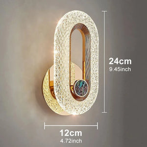 The Luxury Wall Sconce is a modern and stylish oval-shaped LED wall light, measuring 24 cm (9.45 inches) in height and 12 cm (4.72 inches) in width, perfect for indoor lighting and wall mounting.