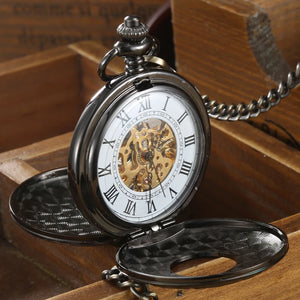 The Vintage Mechanical Pocket Watch features a visible mechanical movement and Roman numeral dial, displayed open on a wooden surface.