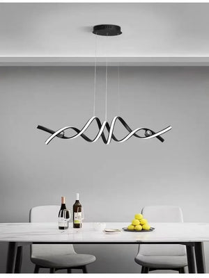 Modern dining room with a Stylish Pendant Light, a table set with wine bottles, glasses, and lemons, paired with two chairs. Gray walls highlight the minimalist design's sculptural appeal.