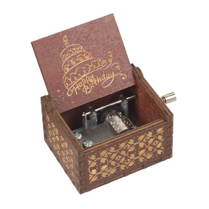 The Happy Birthday Music Box is a small wooden treasure with an open lid that reveals its intricate internal mechanisms. The lid is elegantly engraved with a birthday cake and the words "Happy Birthday." This delightful music box boasts an exterior adorned with a patterned design, making it an ideal birthday gift.