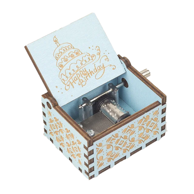 A small, ornate wooden music box with an open lid displaying the engraved text "Happy Birthday" and a cake design on the inside cover. The delightful Happy Birthday Music Box makes for a perfect birthday gift, with its charming musical mechanism nestled inside.