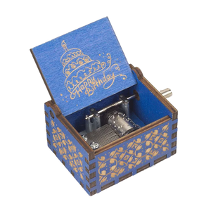 The "Happy Birthday Music Box" is a blue wooden music box with a delightful "Happy Birthday" message and a cake illustration inside the lid, making it the perfect birthday gift.