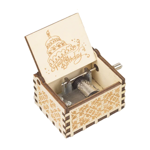 The Happy Birthday Music Box features an open lid adorned with "Happy Birthday" and a cake design, revealing the intricate inner mechanism— making it the ideal birthday gift.