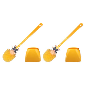 Two Trump Tidy Toilet Brushes with cartoon handles and matching yellow holders are displayed side by side on a white background—a quirky novelty bathroom accessory.
