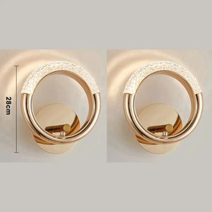 Two gold circular Luxury Wall Sconces featuring textured sections at the top. A measurement of 28 cm is shown next to the left fixture, highlighting modern and stylish indoor lighting.