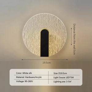 The Beautiful Wall Sconce is a round white silk wall light featuring a black center strip and boasts a 19.5 cm diameter. Crafted from hardware and acrylic, it uses a 5W LED light source and operates on 90-260V. Covering an area of 3-5 m², this contemporary wall sconce perfectly captures minimalist design lighting for a modern luxury appeal.