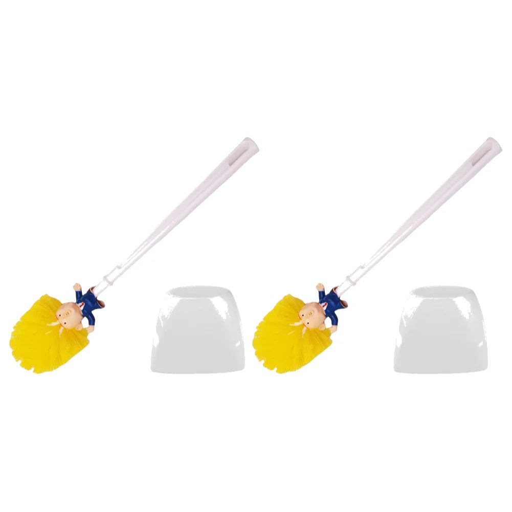 Two Trump Tidy Toilet Brushes featuring cartoon figure handles and yellow bristles, each beside a white holder, create a humorous novelty bathroom accessory set against a white background.