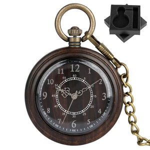 The Wooden Pocket Watch features Roman numerals, ornate hands, a metal chain, and comes with a black foam holder—an elegant classic for any vintage pocket watch collection.