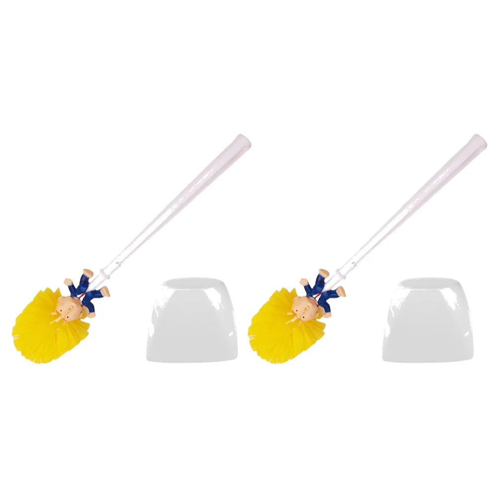Two Trump Tidy Toilet Brushes with yellow bristles and novelty figurine handles are placed next to two white holders, making a humorous and fun bathroom accessory set.