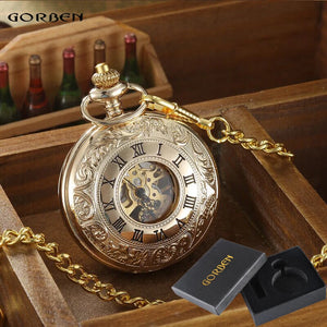 A Vintage Mechanical Pocket Watch with Roman numerals and visible movement on a gold chain is displayed next to a black Gorben-branded box.