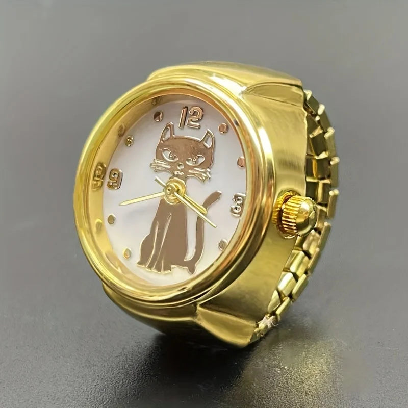 The Cat Ring Watch features a gold band and a black cat illustration on the face, accented with gold numerals and hands. Displayed on a dark surface, this unique timepiece is ideal for cat lovers and jewelry enthusiasts alike.