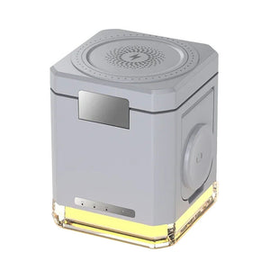 The Universal Charger Night Light SpyCam is a gray, cube-shaped device with a perforated top, control panel, side handle, and transparent base with a glowing yellow light, cleverly concealing its surveillance capabilities.