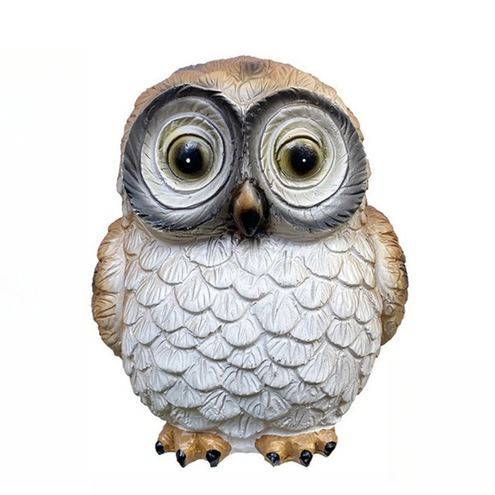 A Solar Owl Light featuring large, round eyes and white, textured feathers stands upright against a plain white background—perfect as an outdoor solar decor accent or paired with your favorite owl figurine to brighten up your garden.