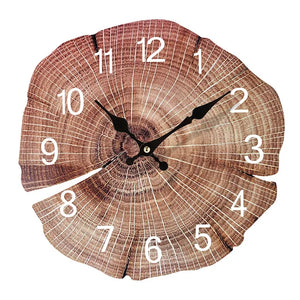 The Wooden Grain Wall Clock is crafted to resemble a tree slice, with black hands and white numerals, seamlessly combining natural elements with a contemporary style.