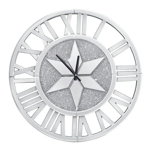 The Astral Chic Roman Wall Clock features a silvery finish, a silver star center, glittery background, open Roman numerals, and black hands set to 10:10.