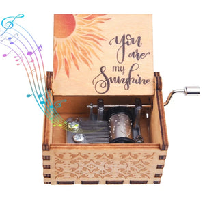 The "Music Box - You Are My Sunshine" features a romantic rotary handle design with a classic melody. This wooden hand-crank music box has a lid adorned with a sun illustration and the heartfelt text "You Are My Sunshine," complemented by colorful musical notes emanating from it.