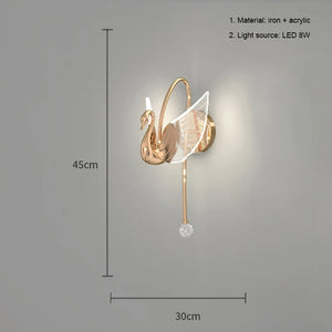 The Swan Wall Light is a sophisticated wall-mounted LED fixture designed in the shape of a swan, made from iron and acrylic. With dimensions of 45cm in height and 30cm in width, this 8W LED light source serves as an exquisite decorative sconce for any indoor setting.