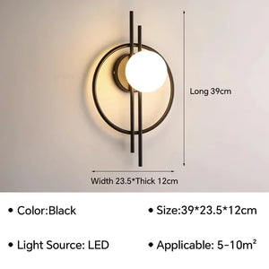 The Circular Wall Sconce with Dual Vertical Rods is a modern wall-mounted LED light fixture featuring a sleek black metal frame. Its dimensions are 39 cm in length, 23.5 cm in width, and 12 cm in thickness, making it ideal for rooms sized between 5-10 m².