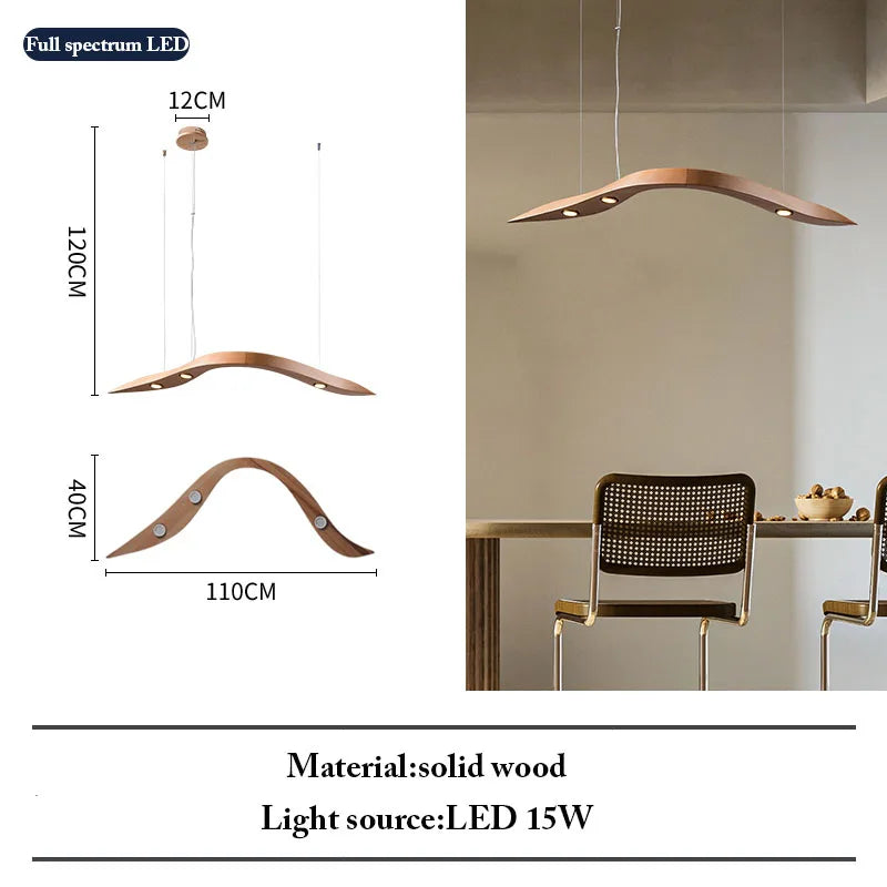 The Spiral Wood Pendant Light features a modern helical, curved design in solid wood, measuring 120cm high, 110cm wide, and 40cm deep. Shown above a dining table and chairs, it uses an LED 15W light—ideal for organic modern lighting.