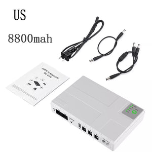 A Portable UPS for WiFi Router set, featuring a 10400mAh battery. This kit includes a user manual, power cables, and various connectors, all laid out on a white background. It's perfect for providing backup power to your WiFi router during outages.