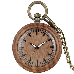 The Wooden Pocket Watch features a round wooden case, black hour marks, black hands set to 7:24, and comes with a brass chain attached to the top.