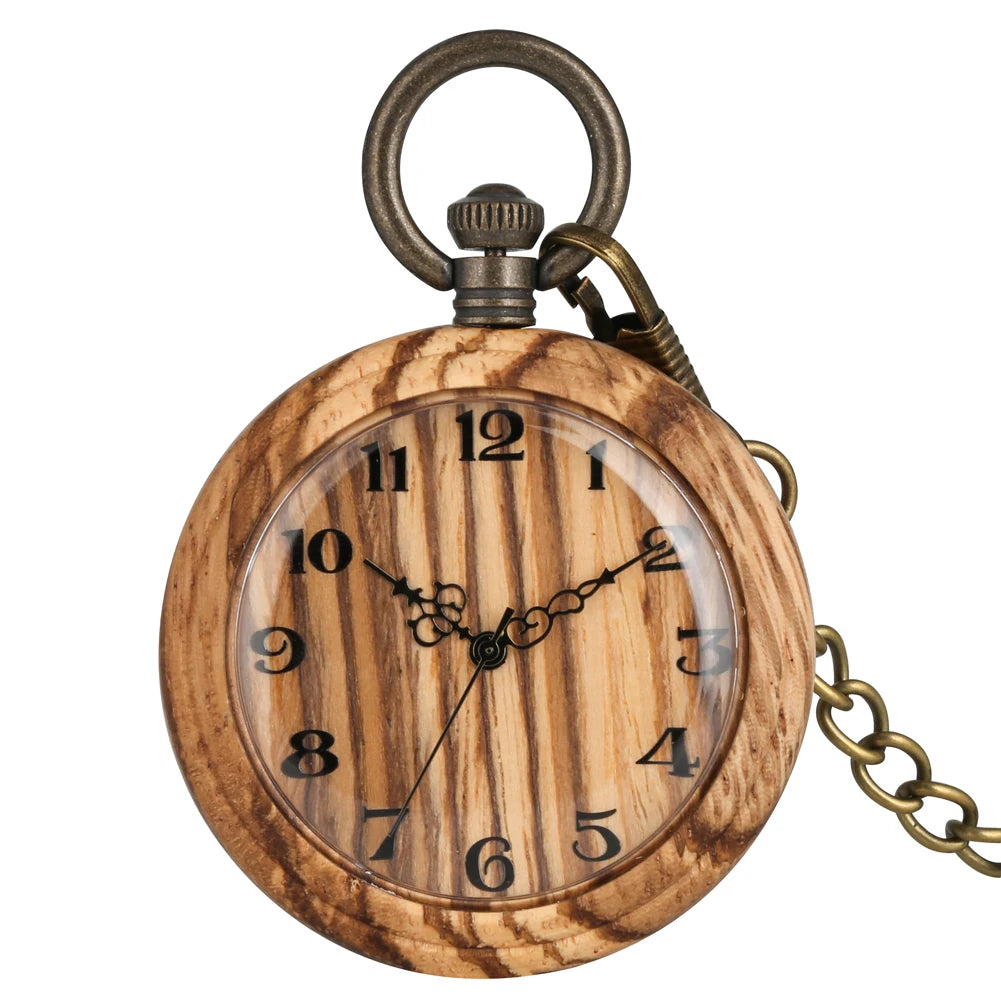 The Wooden Pocket Watch, part of a wood watch collection, features black numerals and ornate hands. It hangs from a bronze chain and is displayed against a white background.