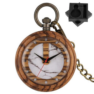 The Wooden Pocket Watch features a marble-patterned clock face, black and red hands, a brass chain, and comes with a black foam insert for storage—making it a standout in our collection.
